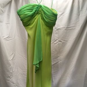 Green long dress. With thin straps.